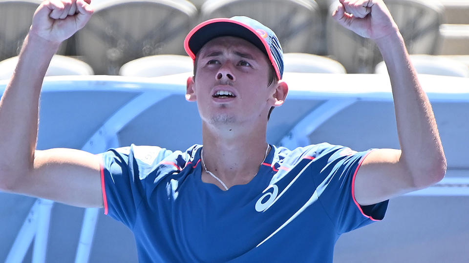 Alex De Minaur celebrates beating Gilles Simon. (Photo by PETER PARKS/AFP/Getty Images)