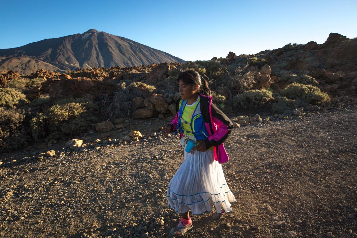 Mexican cattle farmer and part time long distance runner Maria Lorena Ramirez,22, competes through the El Teide National park near Los Realejos in the Ultra category of the Cajamar Tenerife Bluetrail 2017, a 97km mountain race held over 23 hours across the Island starting from sea level up to 3,555 meters on the Spanish Canary island of Tenerife, on June 10, 2017.  Lorena Ramirez, who competes in sandals and traditional garb had to be evacuated by helicopter due to severe knee pain and her brother finished the race which crosses the El Teide national park. / AFP PHOTO / DESIREE MARTIN        (Photo credit should read DESIREE MARTIN/AFP/Getty Images)