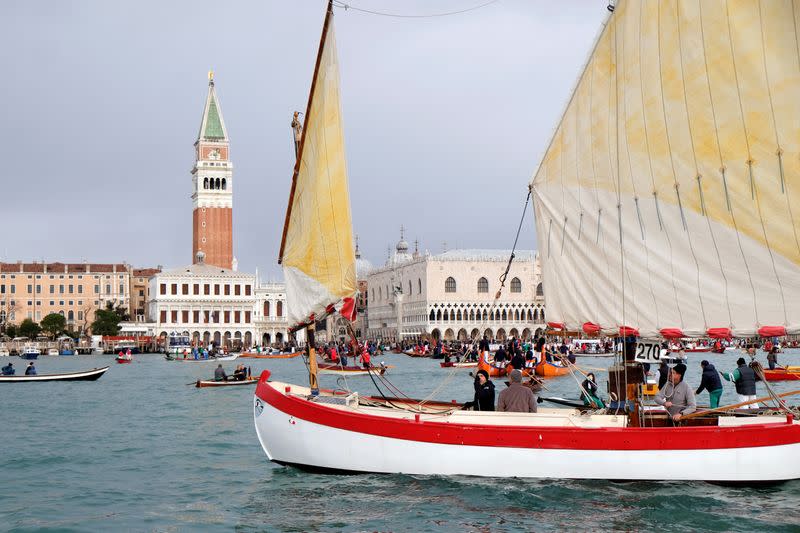 Scores of boats take to the Saint Mark's Basin, as Venetians protest against the damage caused by big ships, in Venice