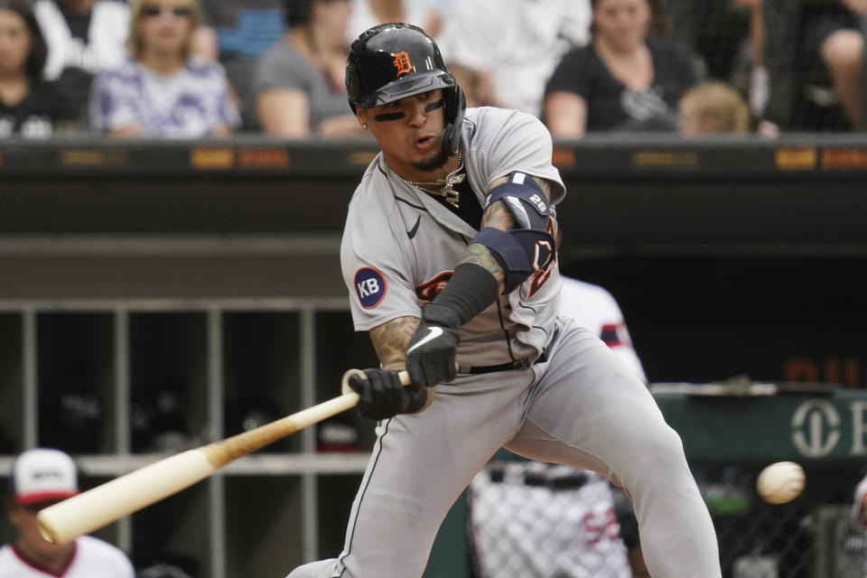 Detroit Tigers' Javier Baez hits a one-run double against the Chicago White Sox during the third inning of a baseball game in Chicago, Sunday, Aug. 14, 2022. (AP Photo/Nam Y. Huh)