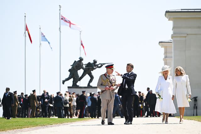 <p>Eddie Mulholland - Pool/Getty</p> King Charles, President Emmanuel Macron, Queen Camilla and Brigitte Macron at the Ministry of Defense and Royal British Legion's event commemorating the 80th anniversary of the D-Day Landings at the British Normandy Memorial on June 06, 2024, in Ver-Sur-Mer, France.