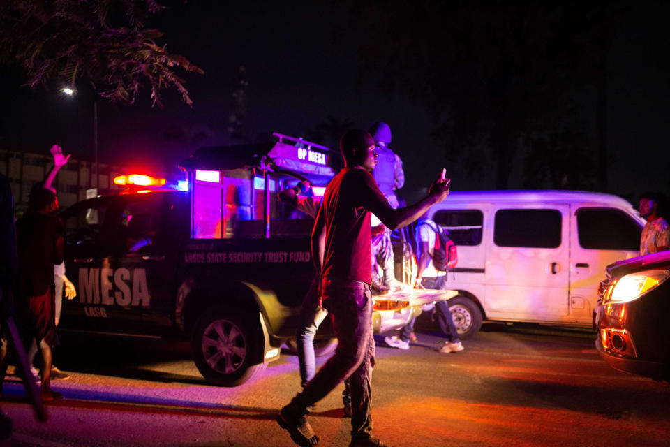 Image: A Lagos State Security patrol car drives through Nigerian protesters demonstrating in the streets of Alausa Ikeja (Benson Ibeabuchi / AFP - Getty Images)