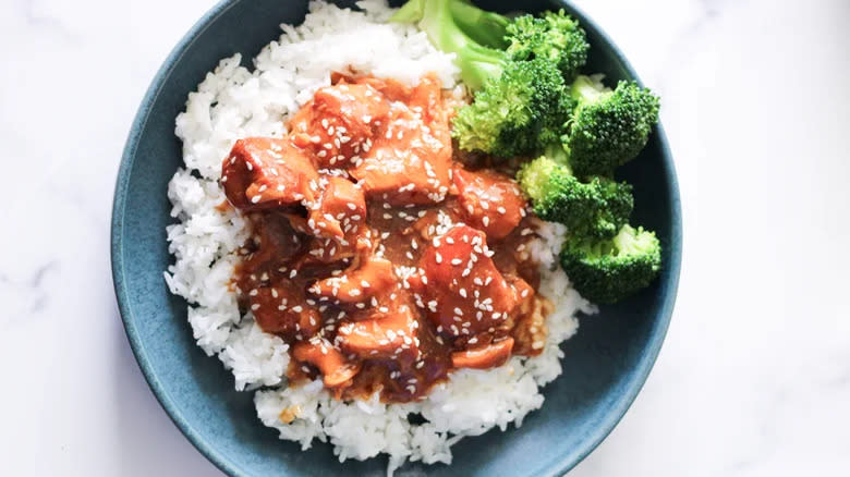 Chicken in sauce on rice with broccoli