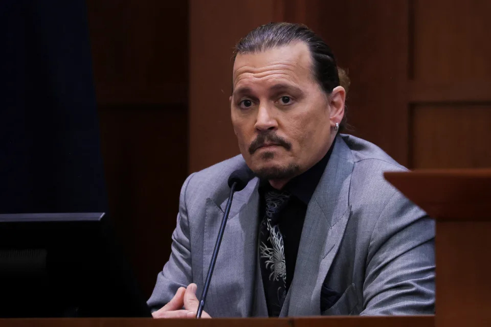 Johnny Depp testifies during his defamation trial against his ex-wife Amber Heard at the Fairfax County Circuit Courthouse on April 20, 2022