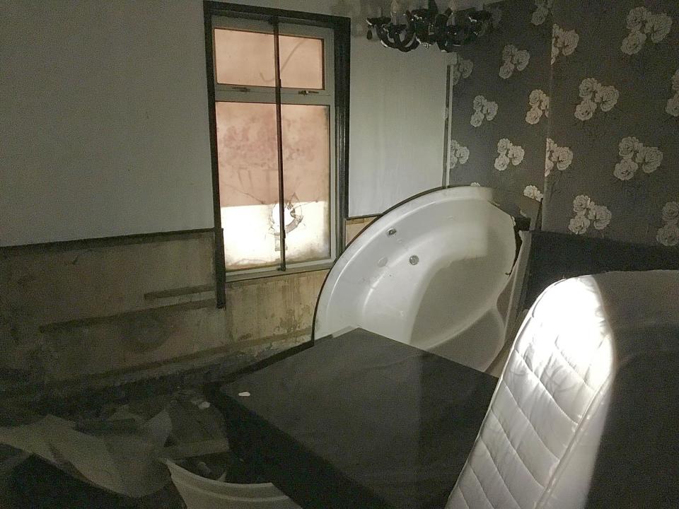 PIcture shows inside one of the rooms at the former City Sauna, including a mattress and a bath tub (Photo: Submitted)
