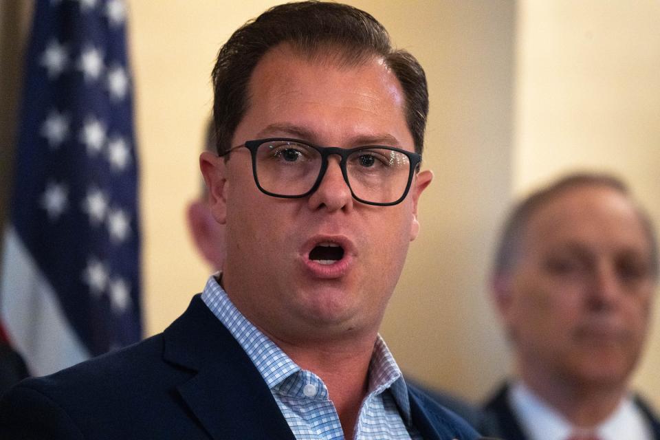 Jake Hoffman speaks during an Arizona Freedom Caucus press conference in the historic Senate Chamber at Arizona State Capitol.