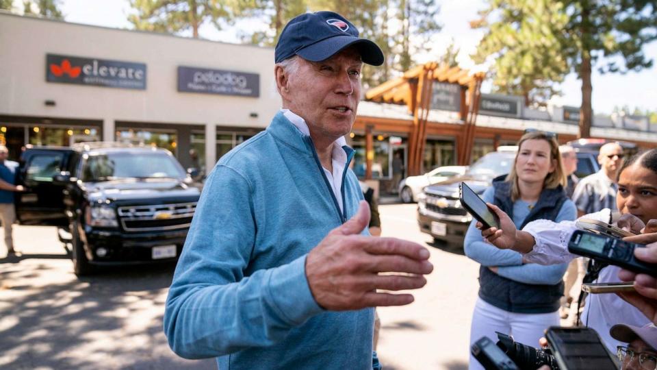 PHOTO: President Joe Biden talks with reporters after taking a Pilates and spin class at PeloDog, Aug. 25, 2023, in South Lake Tahoe, Calif. (Evan Vucci/AP)