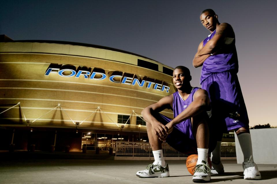 Chris Paul, left, and J.R. Smith of the New Orleans/Oklahoma City Hornets in front of the Ford Center in Oklahoma City on Oct. 17, 2005.