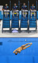 Judges watch as China's He Chong performs a dive during the men's 3m springboard preliminary round at the London 2012 Olympic Games at the Aquatics Centre August 6, 2012. REUTERS/Toby Melville (BRITAIN - Tags: SPORT DIVING OLYMPICS SPORT SWIMMING) 