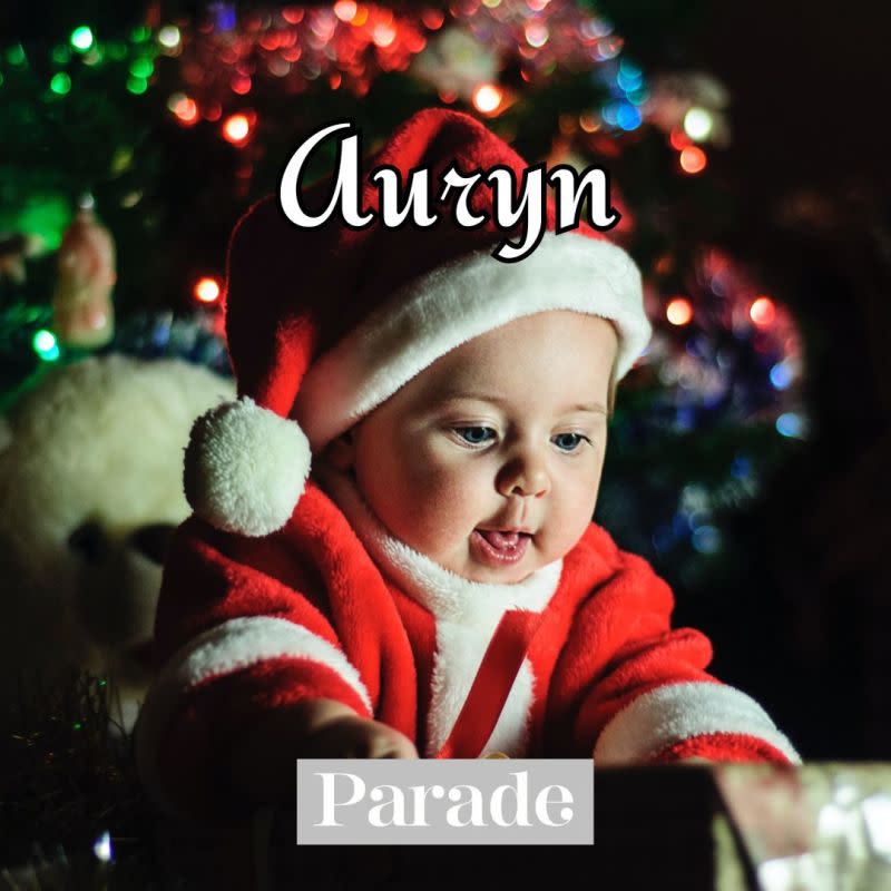 A baby boy plays with a Santa outfit on.<p>Unsplash</p>