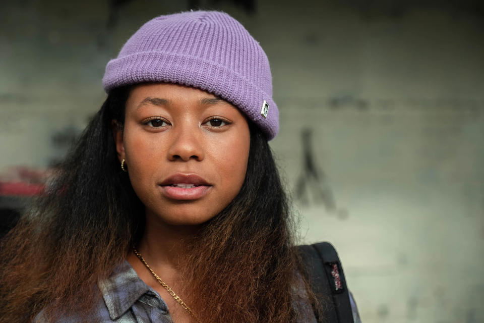 Young woman wears a purple beanie in still from On the Come Up. 