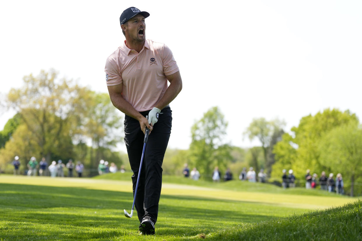 Bryson DeChambeau reacts to his shot on the 17th hole during the first round of the PGA Championship at Oak Hill Country Club on Thursday, May 18, 2023, in Pittsford, N.Y. (AP Photo/Seth Wenig)