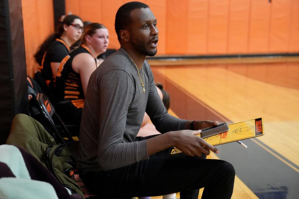 Hasbrouck Heights Assistant Girls Basketball Coach, Madut Bol, gives instructions to his players, Tuesday, January 23, 2024. They went on to beat Wallington, 50-8.
