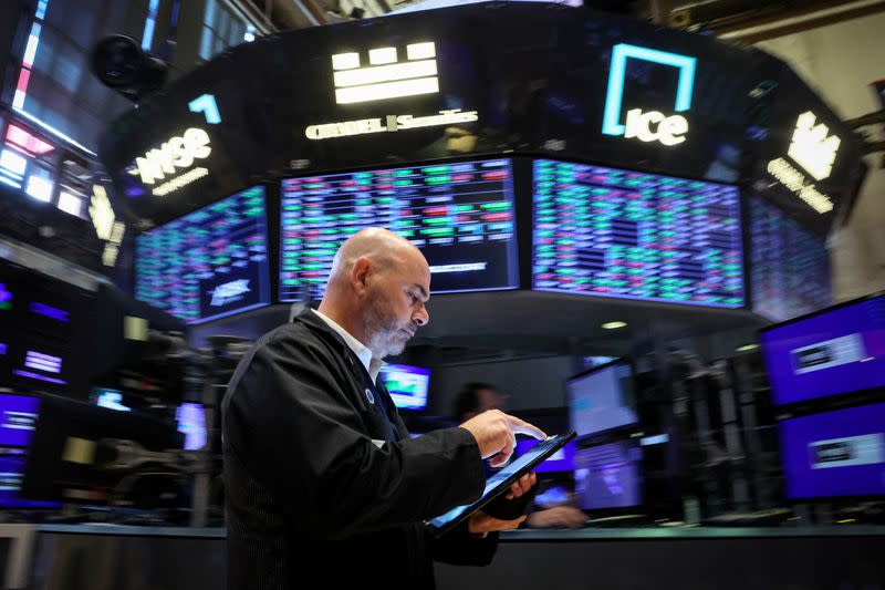 A trader works on the floor of the NYSE in New York