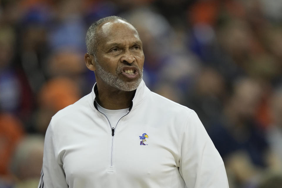 Kansas assistant coach Norm Roberts talks to his players during the first half of an NCAA college basketball game against West Virginia in the second round of the Big 12 Conference tournament Thursday, March 9, 2023, in Kansas City, Mo. (AP Photo/Charlie Riedel)