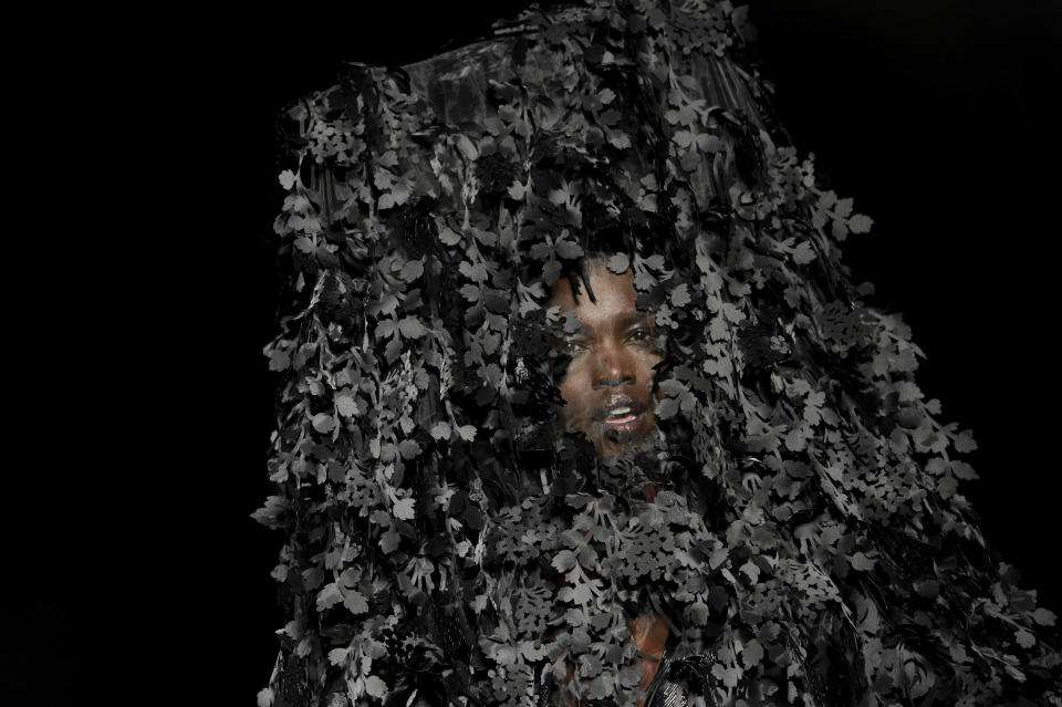 A model wears a design from the Philip Treacy Spring/Summer 2013 collection during London Fashion Week, Sunday, Sept. 16, 2012. (AP Photo/Jonathan Short)