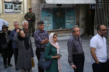 Iranian people stand in a queue to vote during the presidential election in Tehran, Iran, May 19, 2017. TIMA via REUTERS