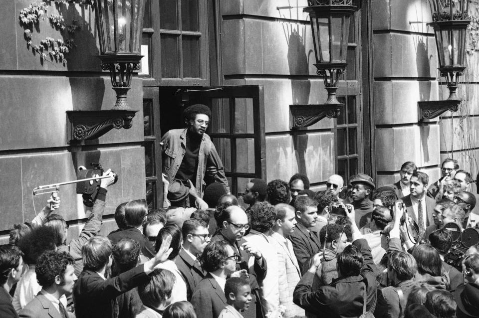 Civil rights leader H. Rap Brown converses with the crowd outside the student-occupied Hamilton Hall on the Columbia University campus