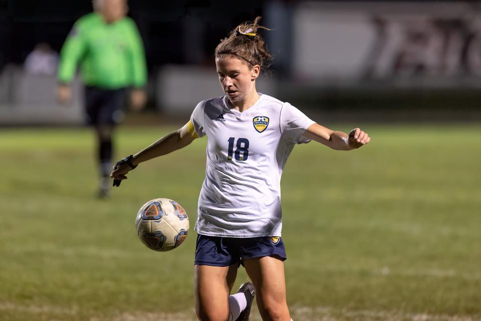 Streetsboro star midfielder Madelyn Genovese runs with the ball against Field last year.