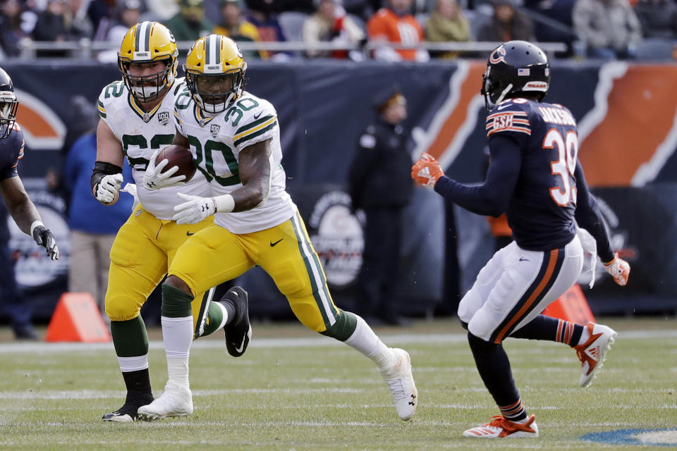 Green Bay Packers running back Jamaal Williams (30) runs against Chicago Bears defensive back Eddie Jackson (39) during the first half of an NFL football game against the Chicago Bears Sunday, Dec. 16, 2018, in Chicago. (AP Photo/Nam Y. Huh)