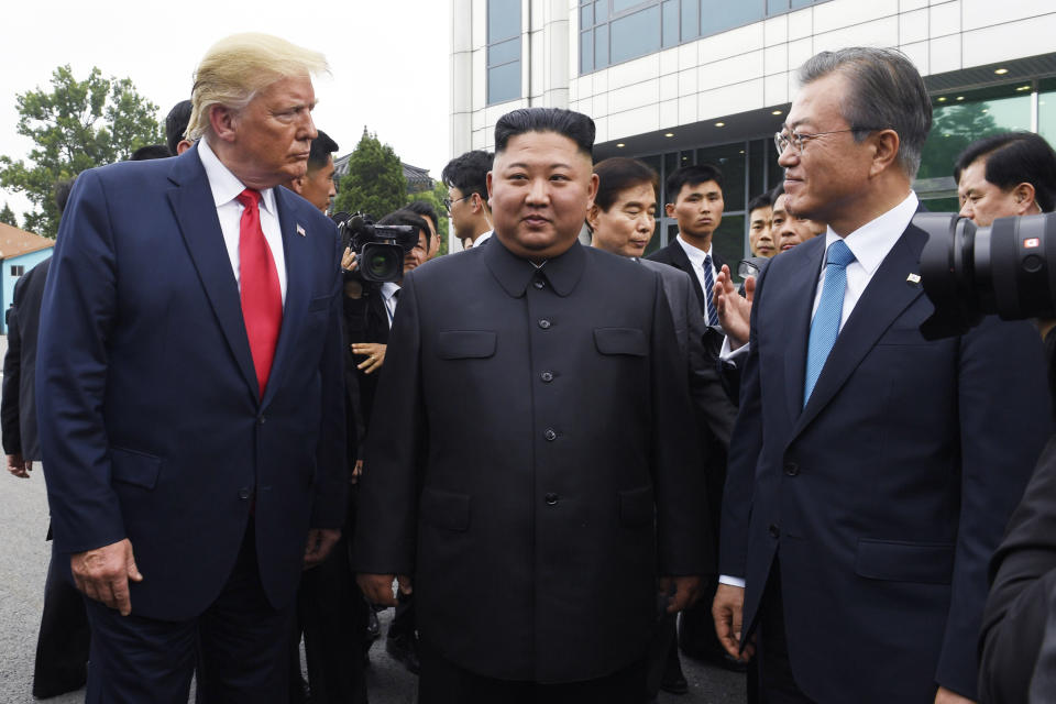 FILE - In this June 30, 2019, file photo, President Donald Trump, left, meets with North Korean leader Kim Jong Un and South Korean President Moon Jae-in, right, at the border village of Panmunjom in the Demilitarized Zone, South Korea. North Korea on Saturday, June 13, 2020 again bashed South Korea, telling its rival to stop “nonsensical” talk about its denuclearization and vowing to expand its military capabilities. (AP Photo/Susan Walsh)