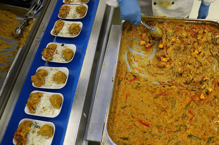 An Indian curry dish is prepared by employees of LSG Group, Lufthansa's airline catering division, at the LSG headquarters in Frankfurt, Germany, November 11, 2016. REUTERS/Kai Pfaffenbach