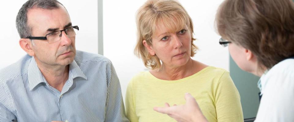 Couple getting financial advice from consultant at home