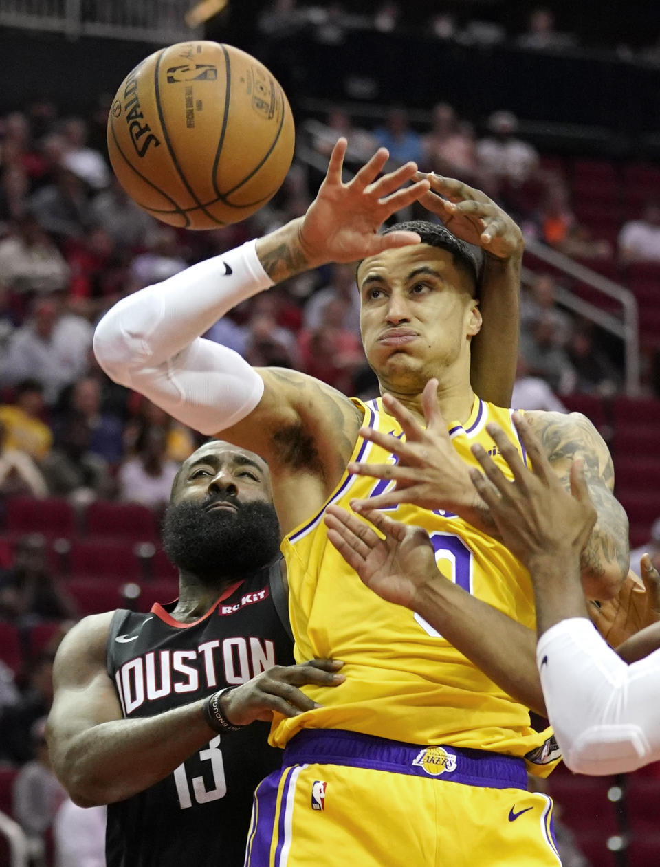 Houston Rockets' James Harden (13) knocks the ball from Los Angeles Lakers forward Kyle Kuzma (0) during the first half of an NBA basketball game Thursday, Dec. 13, 2018, in Houston. (AP Photo/David J. Phillip)