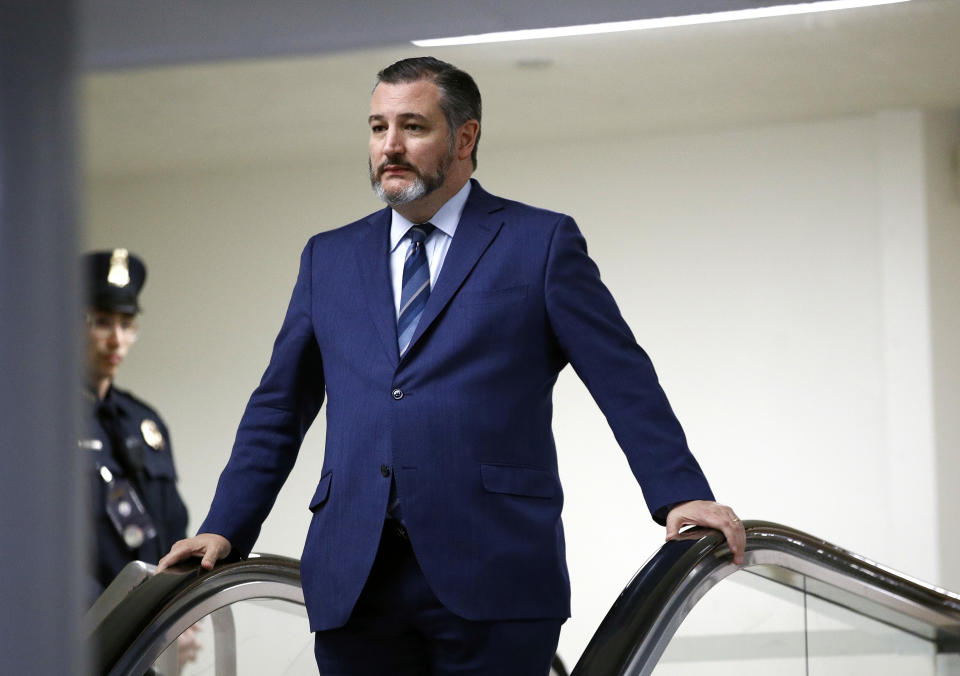 FILE - In this Jan. 29, 2020, file photo, Sen. Ted Cruz, R-Texas, rides an escalator before speaking with reporters on Capitol Hill in Washington. GOP Sen. Cruz said Sunday, March 8, 2020, he will remain at his home in Texas after learning that he shook hands and briefly chatted with a man in suburban Washington who has tested positive for coronavirus. (AP Photo/Patrick Semansky, File)