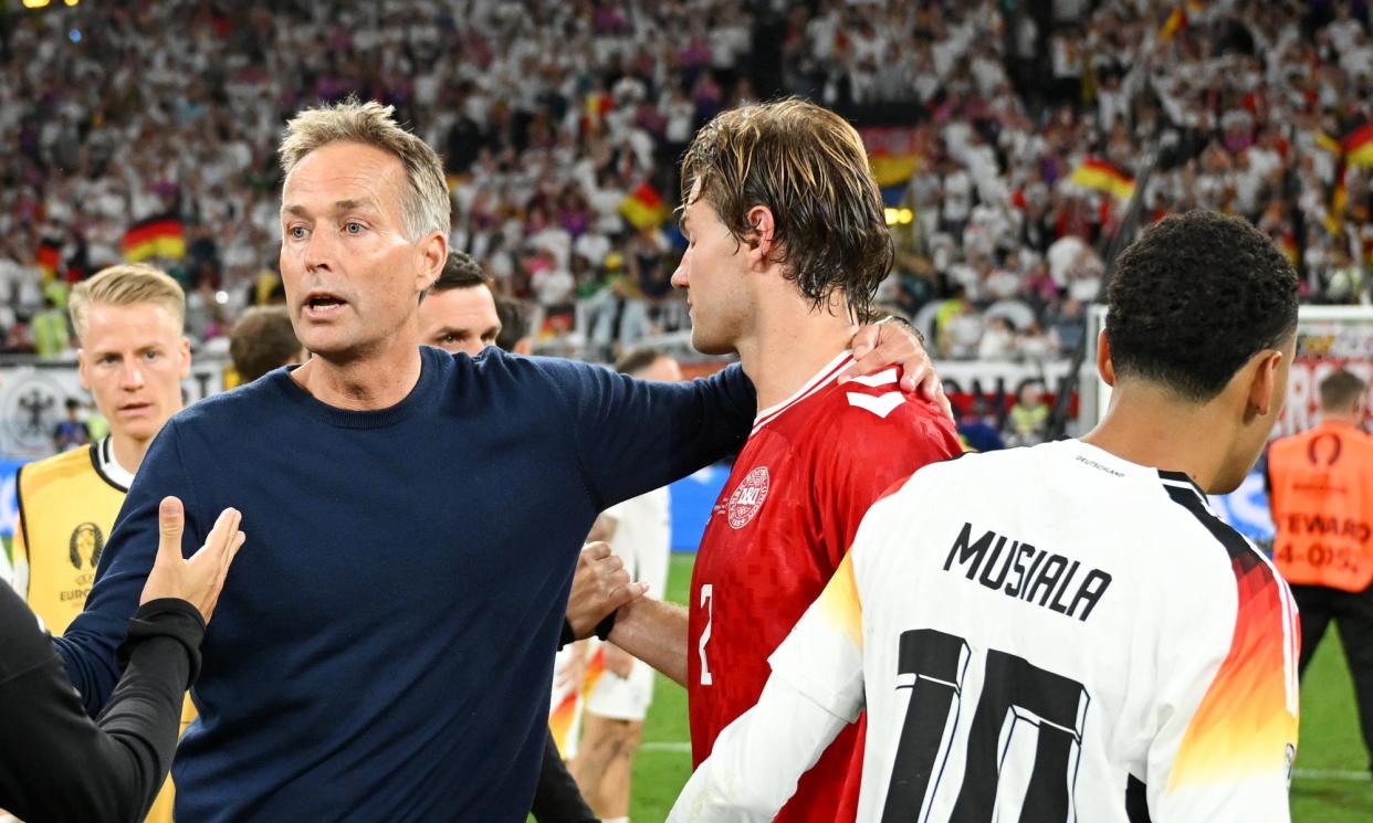 <span>Kasper Hjulmand puts an arm around Joachim Andersen, who was penalised for handball moments after thinking he had scored.</span><span>Photograph: Michael Regan/Uefa/Getty Images</span>