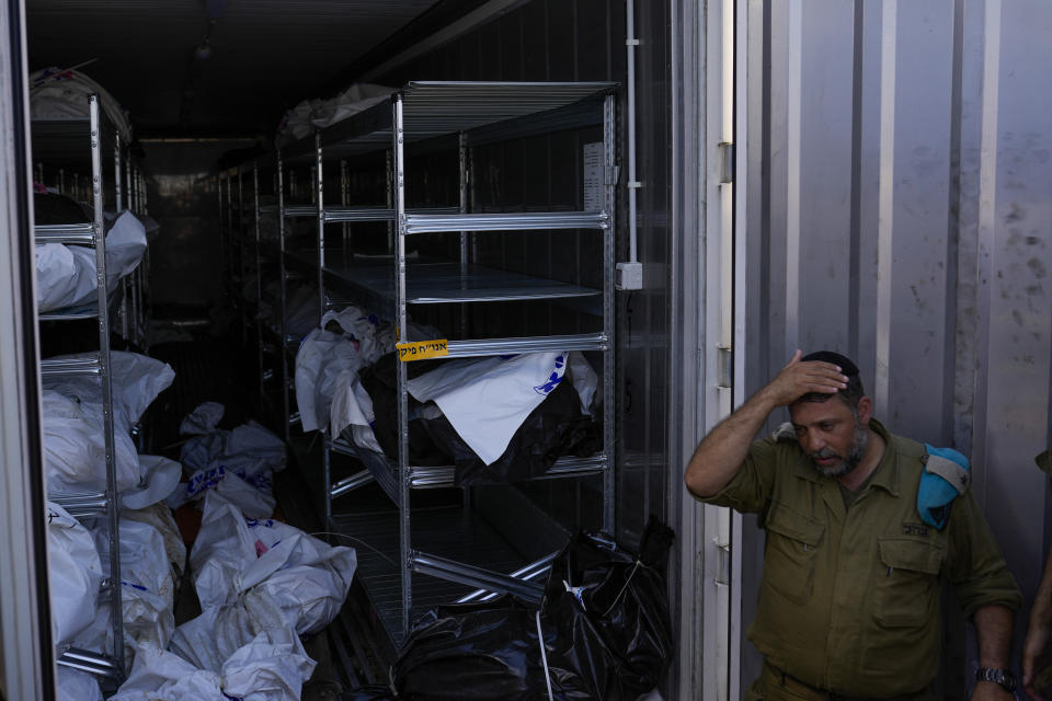 The bodies of Israelis killed in an unprecedented Hamas attack are gathered for identification at a military base in Ramla, Israel, Friday, Oct. 13, 2023. Israeli officials say 1,300 people were killed when Hamas militants burst across the border last Saturday and went on a deadly rampage through Israeli border towns, villages, army bases and a music festival. (AP Photo/Francisco Seco)