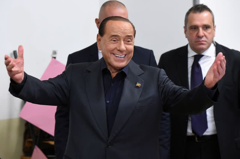 FILE PHOTO: Former PM Berlusconi casts his vote in the European Parliament election in Milan