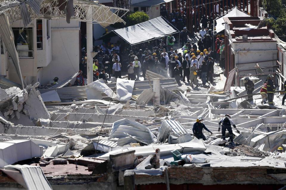 Rescue workers are seen at the site of an explosion at a maternity hospital in Mexico City