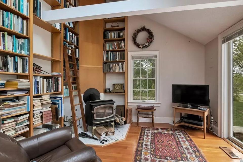 The three-bedroom house at 87 Seventh Ave. in Barnstable includes a room with floor-to-ceiling bookshelves and a sliding ladder.