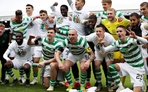 Celtic celebrate winning the title earlier this month - Credit: Getty Images