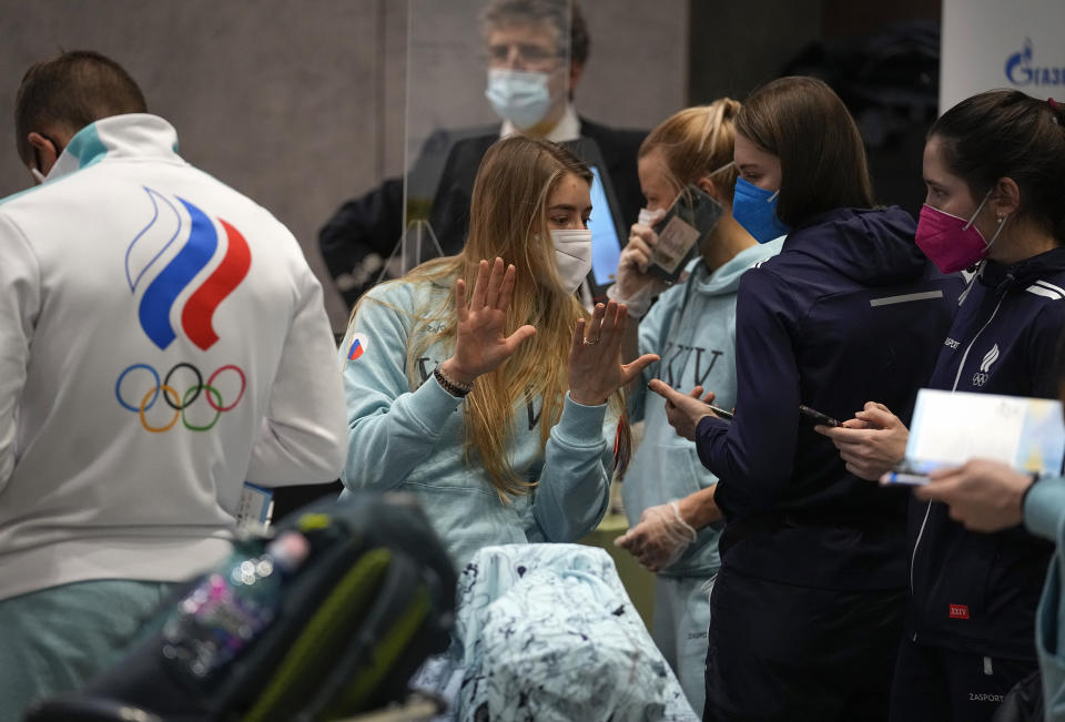 Members of the Russian Olympic Committee team before their departure for the 2022 Winter Beijing Olympic Games in Moscow's Sheremetyevo airport, Russia, Wednesday, Jan. 26, 2022. (AP Photo/Pavel Golovkin)