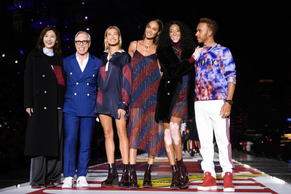 Lewis Hamilton with Jiang Shuying, Tommy Hilfiger, Hailey Baldwin, Joan Smalls, and Winnie Harlow at the Tommy Hilfiger show on September 4, 2018.