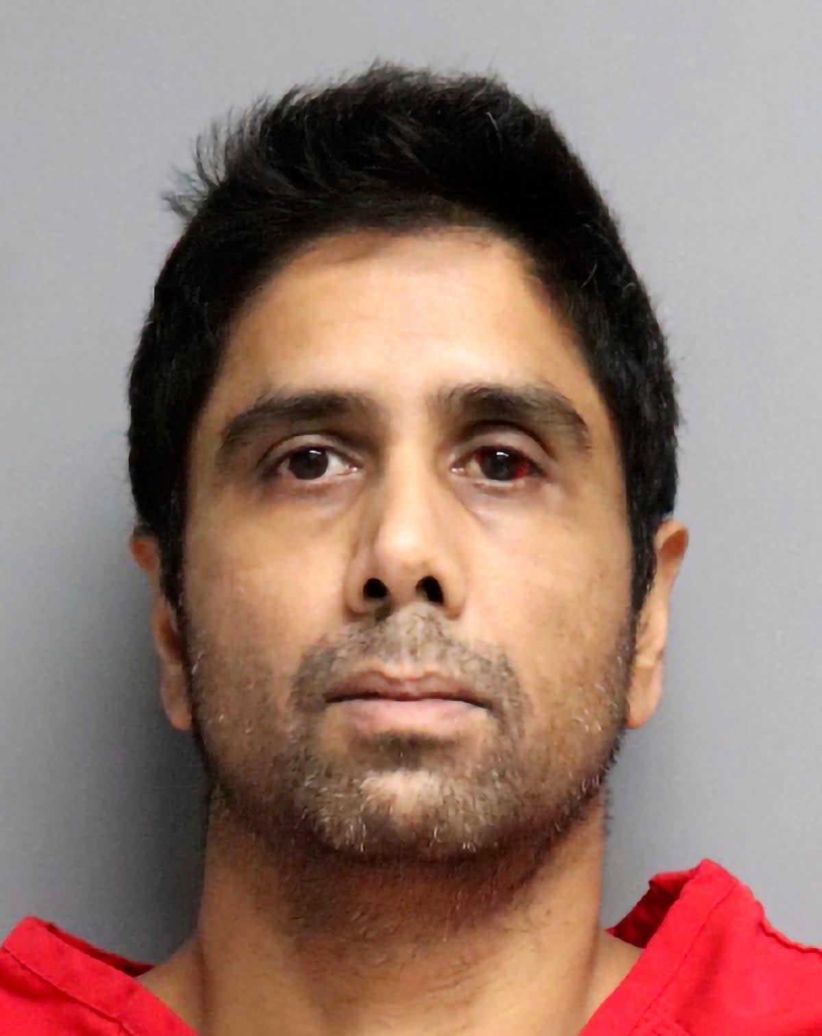 Dharmesh Patel, pictured last year, faces attempted murder charges after prosecutors say he drove his wife and two children off a cliff in California (San Mateo County Sheriff’s Office)