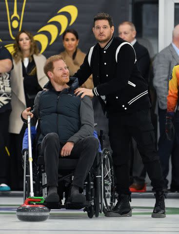 <p>Karwai Tang/WireImage</p> Harry, Duke of Sussex, Meghan, Duchess of Sussex and Michael Buble on February 16, 2024 in Vancouver, Canada.