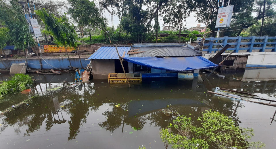 Floodwater nearly drowned entire homes in West Bengal, India on May 21. Source: AAP