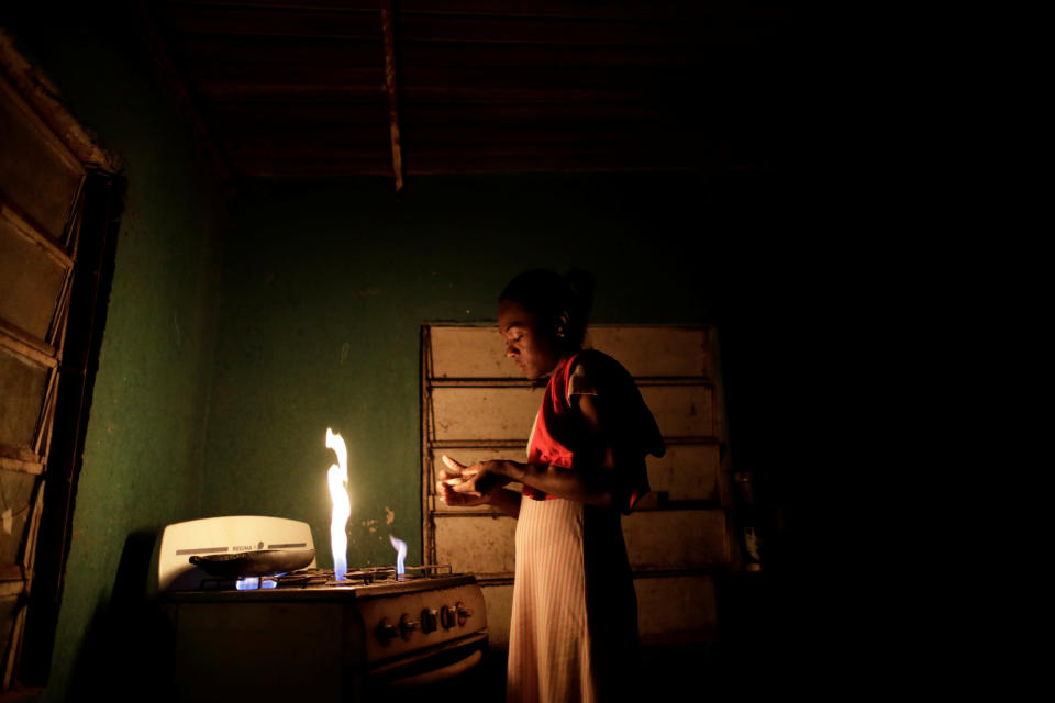 Aidalis Guanipa, 25, a kidney disease patient, prepares her breakfast, before a day of dialysis, at her home, during a blackout in La Concepcion, Venezuela. "I should have been born rich to be able to buy myself a new kidney," said Guanipa. They get by on her 83-year-old grandmother's pension and from sales of homemade sweets. "I have not had dialysis for two days because there has been no electricity. I am scared." (Photo: Ueslei Marcelino/Reuters)