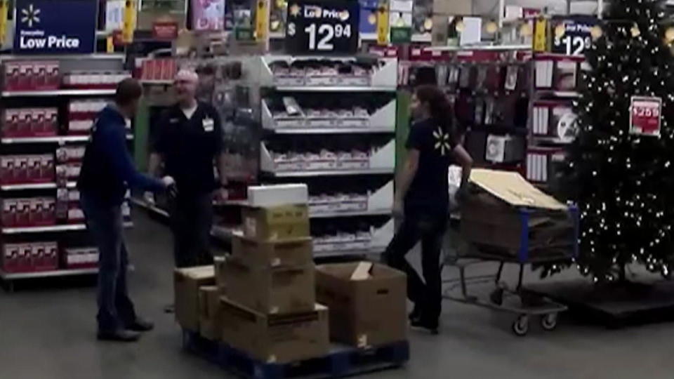 Kristen Trickle, right, is seen at work on a Walmart surveillance camera at the time the cellphone search was made. / Credit: Ellis County Attorney's Office