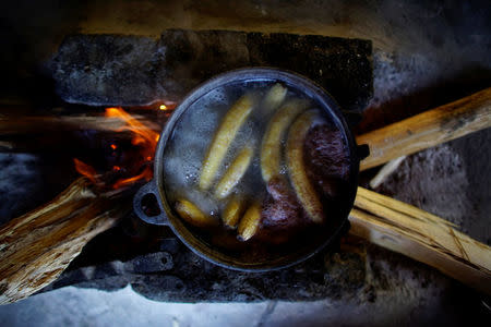 Bananas are being prepared for lunch in the kitchen of a house in the village of Santo Domingo, in the Sierra Maestra, Cuba, March 29, 2018. REUTERS/Alexandre Meneghini