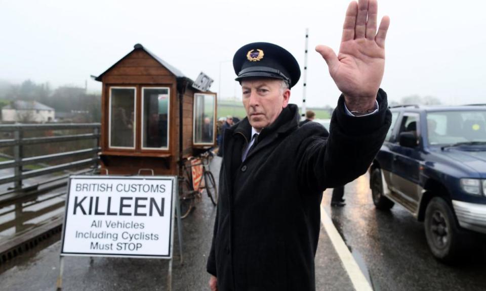 Demonstrators dressed as custom officials set up a mock customs checkpoint at the border crossing in Killeen, near Dundalk to protest against the potential introduction of border checks post-Brexit.