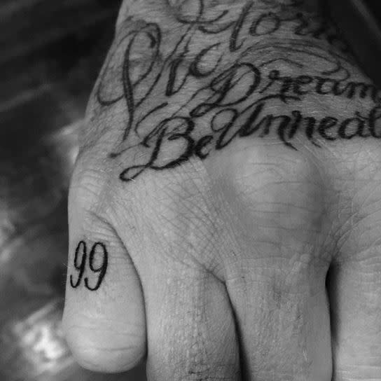David Beckham et son tatouage "99"