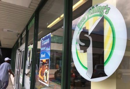 FILE PHOTO: A man enters a Dollar Tree discount store in Garden City, New York