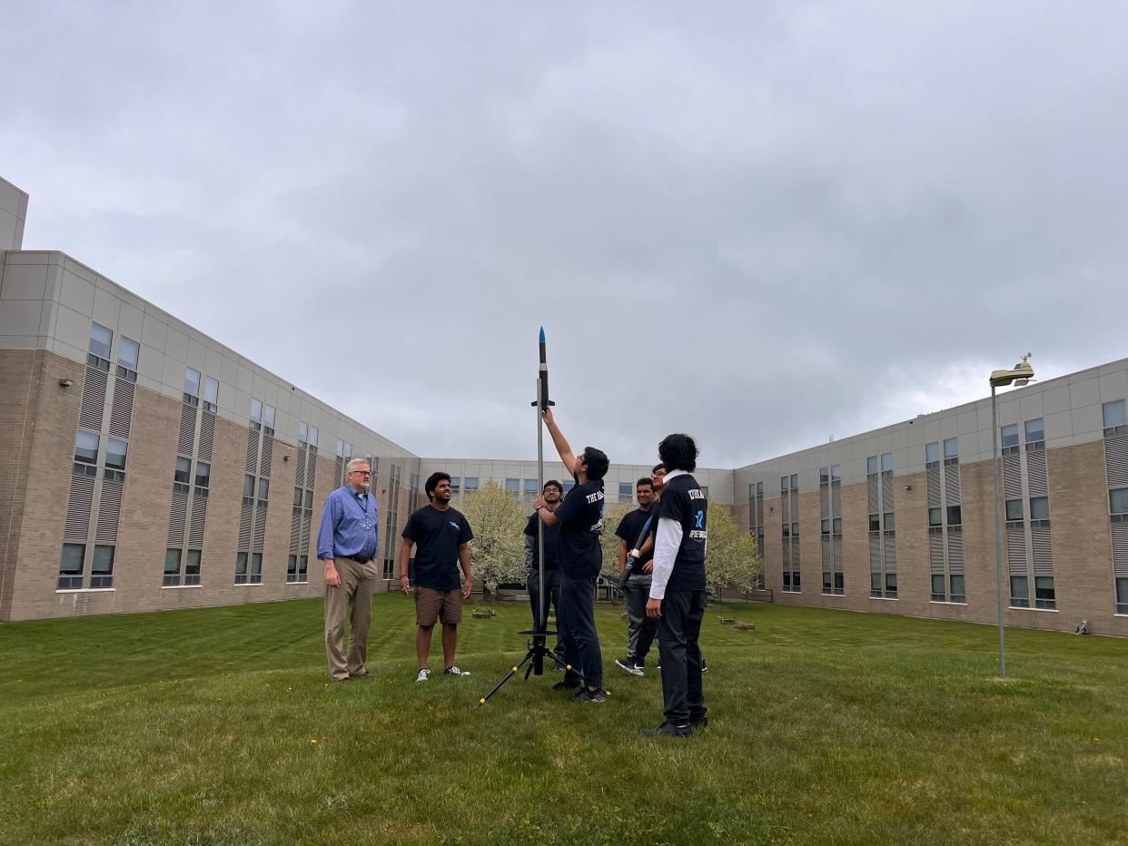 Shrewsbury High School students assemble their rocket