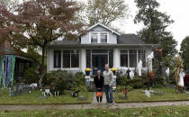 Carol McCarthy and her husband, Tom, pose for a portrait at their home they decorated for Halloween, Monday, Oct. 26, 2020, in Palmyra, N.J. (AP Photo/Michael Perez)