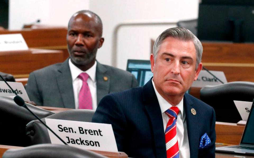 Sen. Kirk deViere, right, and Sen. Ben Clark listen to a speaker during a meeting of the Senate Finance Committee in Raleigh, N.C., Wednesday, June 30, 2021.