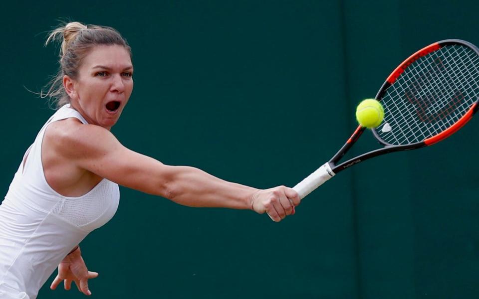 Simona Halep of Romania in action against Victoria Azarenka  - Credit: EPA